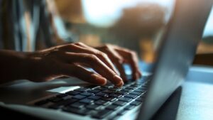 Hands on a laptop keyboard. File pic: iStock