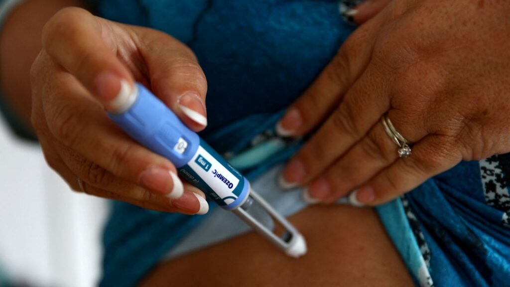 Kim Gradwell with an Ozempic injection needle at her home in Dudley, North Tyneside, Britain, October 31, 2023. Gradwell, a retired receptionist with type 2 diabetes, was not able to get her prescription for Ozempic filled in July through the country’s public health system amid shortages of the medicine that is in high demand from people without diabetes seeking it for its weight-loss effect. REUTERS/Lee Smith