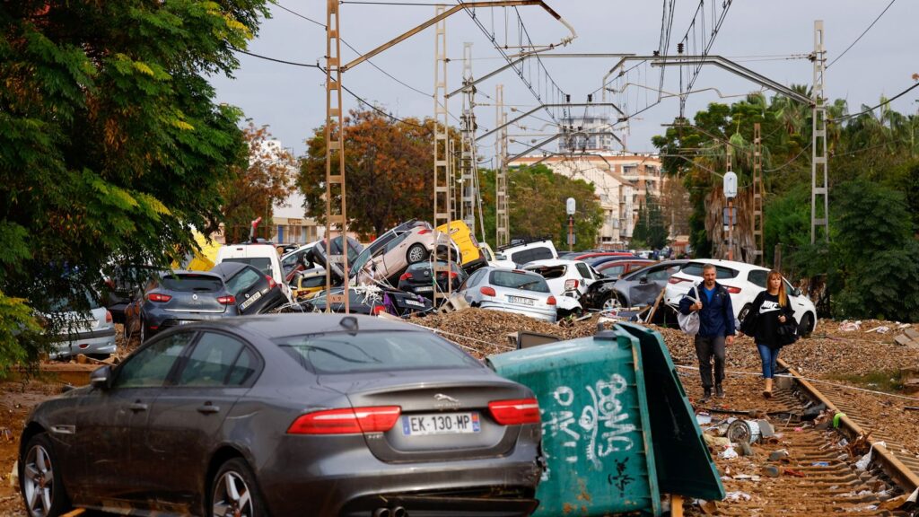 Abandoned cars pile up on railway tracks after flooding in Alfafar, Valencia. Pic: Reuters