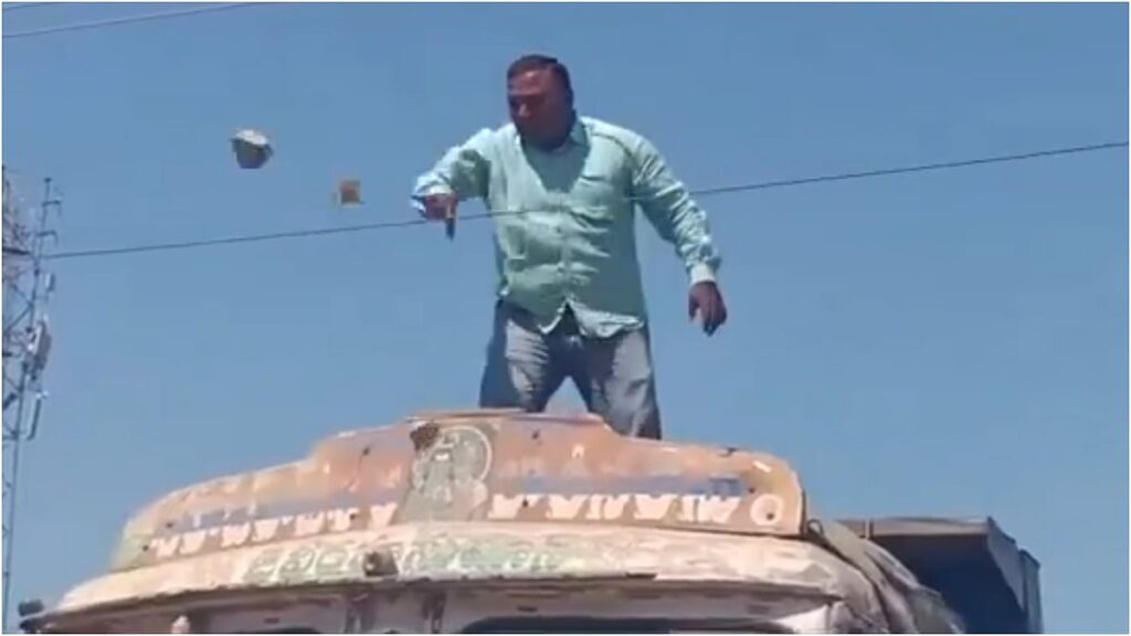 VIDEO: Man Climbs Truck, Threatens Suicide By Touching Live Wires Outside Peddapalli RTO Office,...